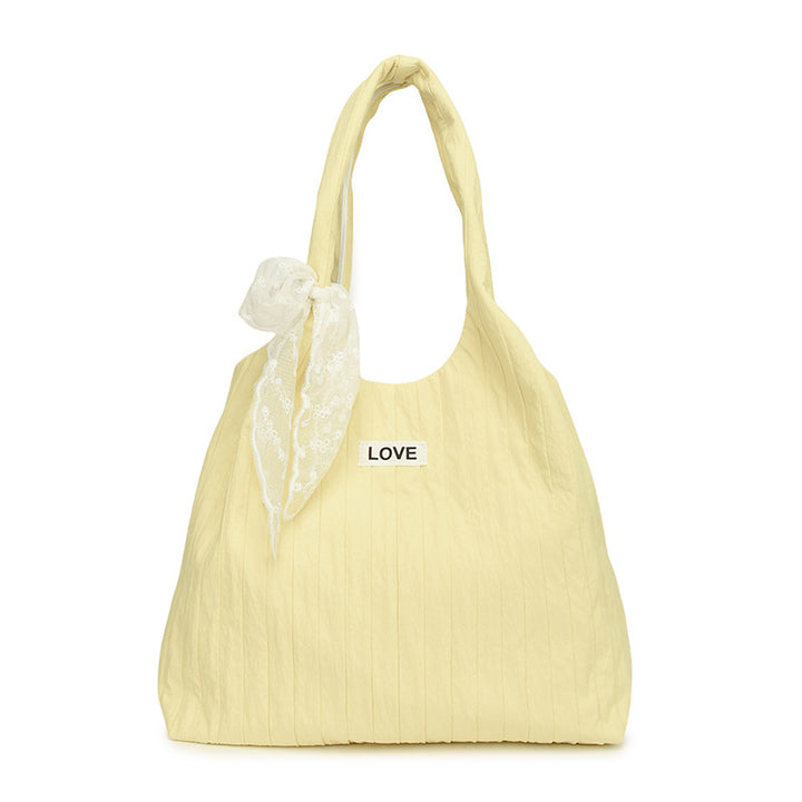 Leisure bag with structured design and playful scarf Bowlift