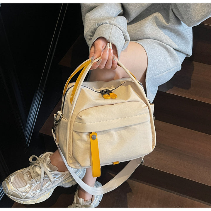 Fashionable shoulder bag with innovative structure and detachable carrying strap Bowlift