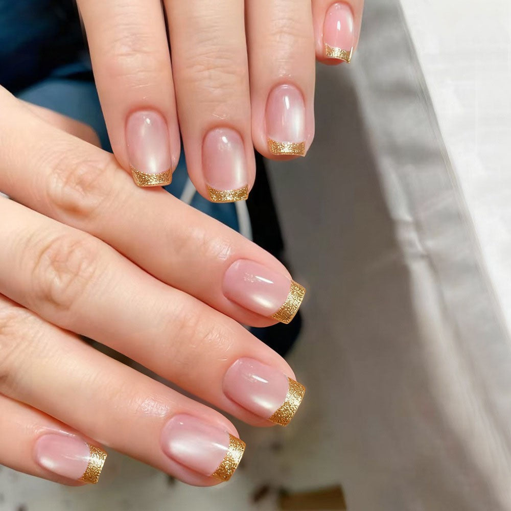 Artificial nails in elegant glitter French design Bowlift