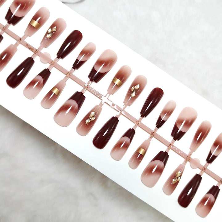 Artificial nails with elegant color gradients and jewelry details Bowlift
