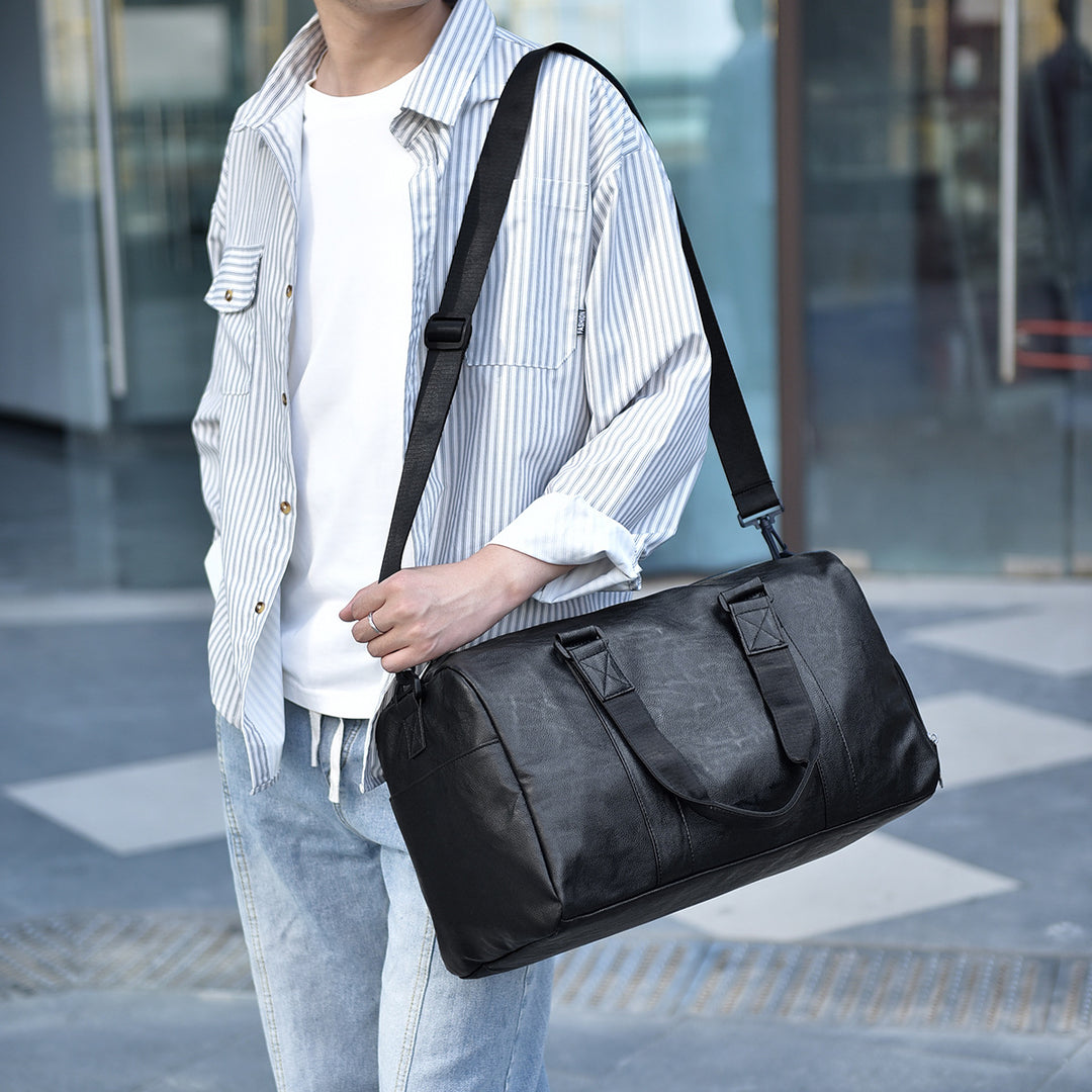 Travel bag made of high-quality leather with robust carrying handles Bowlift