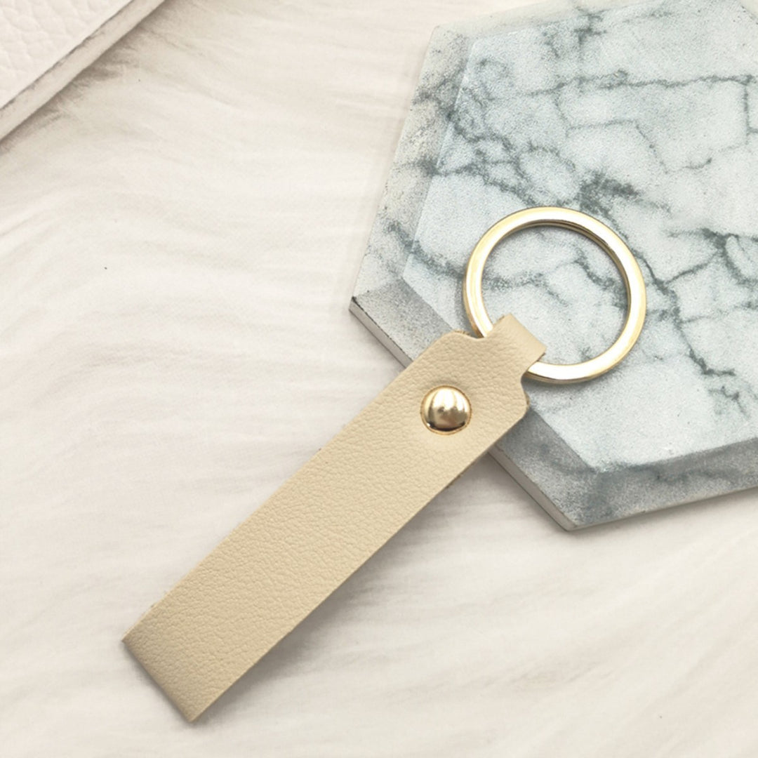 Unisex keychain made of high-quality synthetic leather with elegant metal embellishment Bowlift