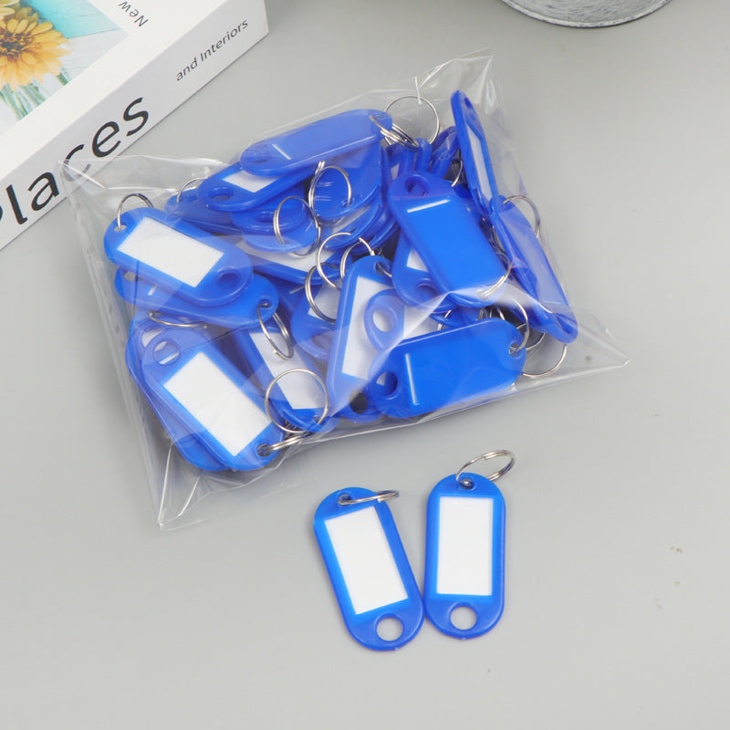 Unisex writable keychain with clear labeling field Bowlift