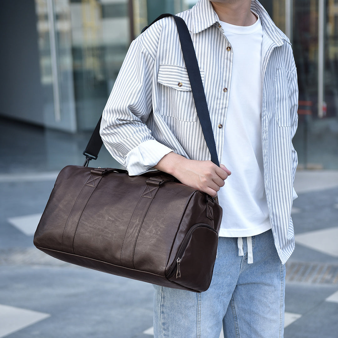 Travel bag made of high-quality leather with robust carrying handles Bowlift