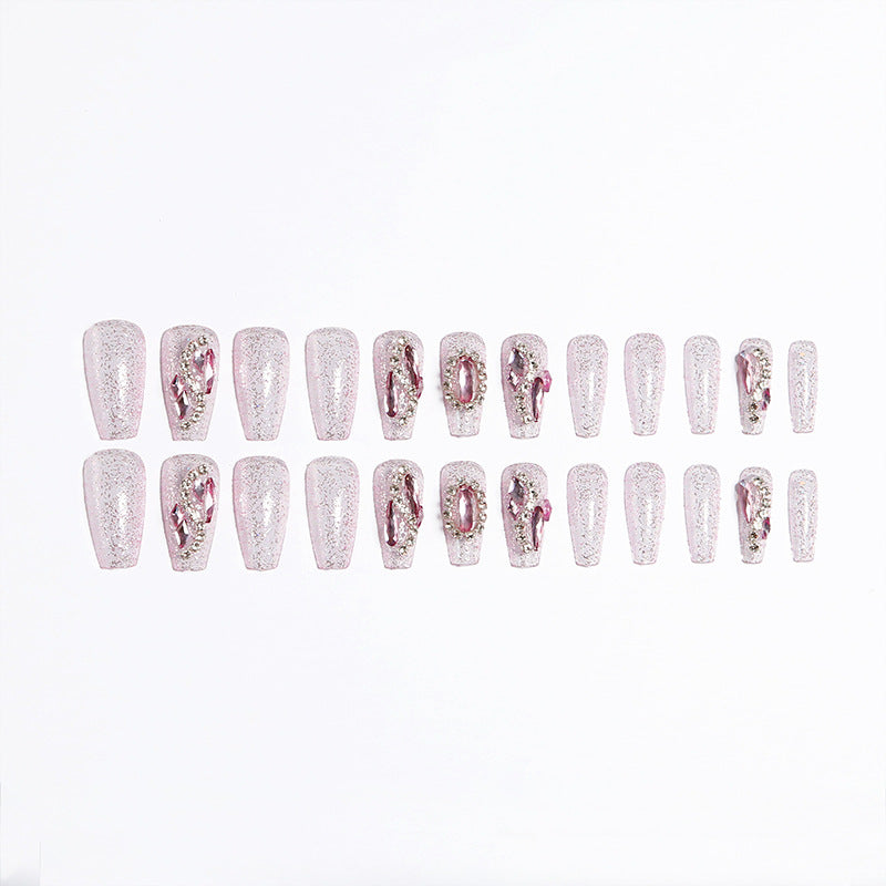 Glamorous artificial nails with sparkling rhinestone decorations Bowlift