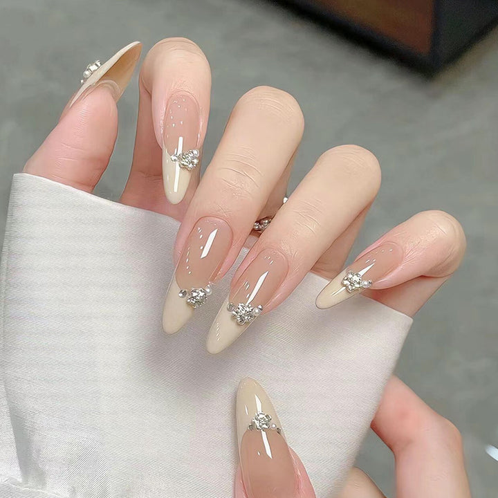 Acrylic nail set with elegant tips and sparkling appliqués Bowlift
