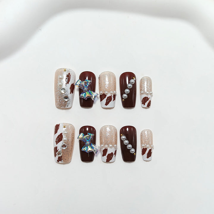 Artificial nails with glamorous 3D applications and glitter Bowlift