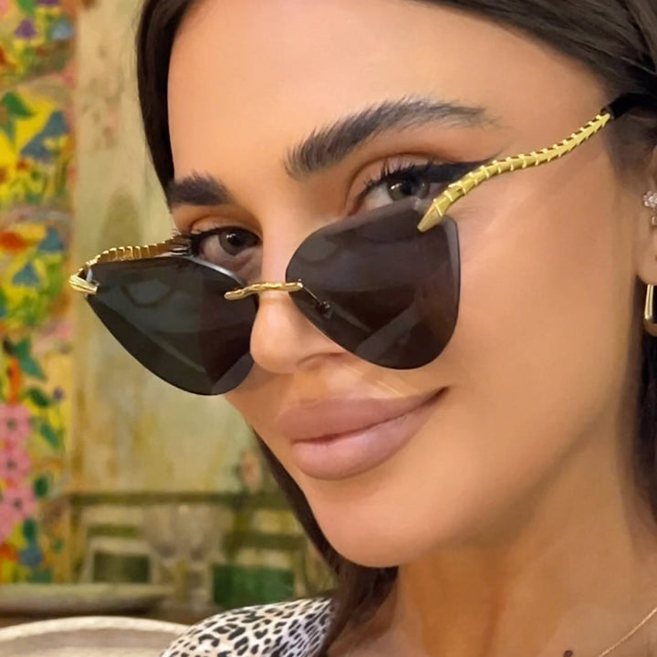 Women's Cat-Eye Sunglasses with unique gold frame design and protective lenses Bowlift