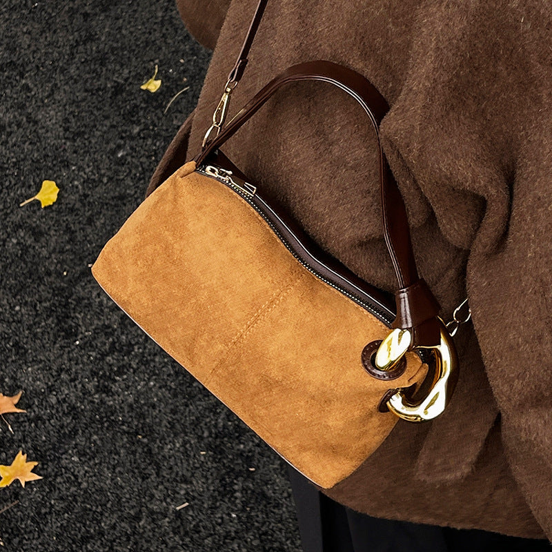 Elegant Suede Handbag with Gold Accents