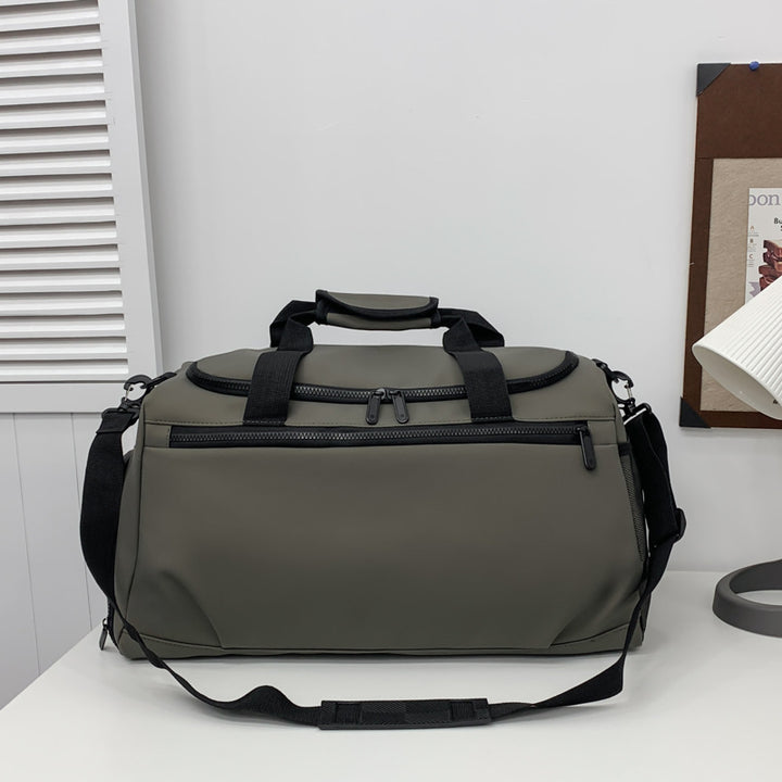 Sporty travel bag with reinforced carrying handles and multiple compartments Bowlift