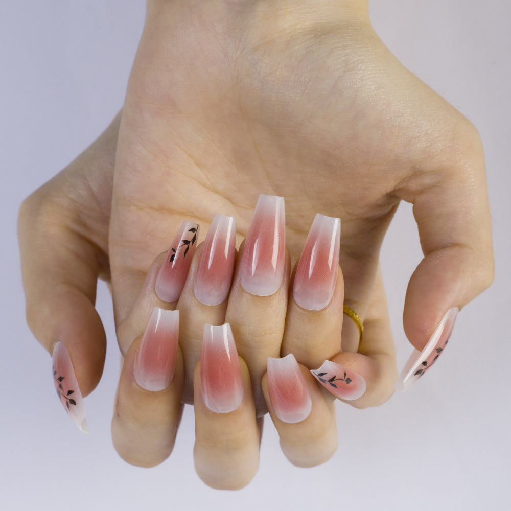 Press-on nails in elegant ombre design with floral accents Bowlift