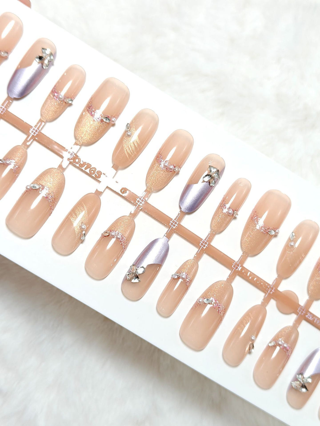 Artificial nails with modern glitter and stone embellishments Bowlift