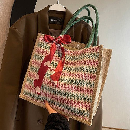 Textured Handbag with Decorative Bow