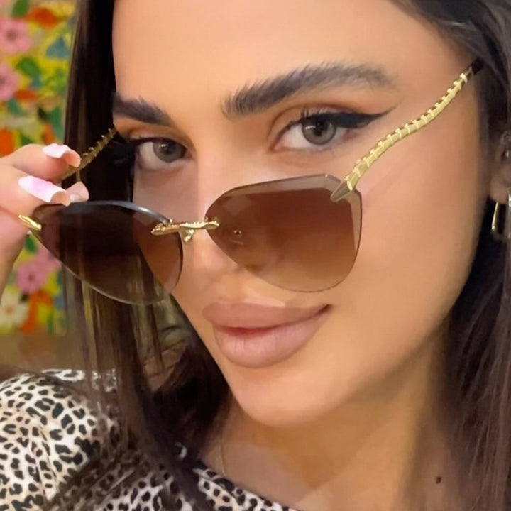 Women's Cat-Eye Sunglasses with unique gold frame design and protective lenses Bowlift