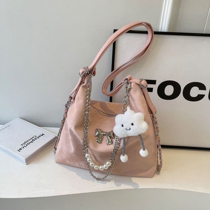 Fashionable handbag with unique pendant and chain accents Bowlift