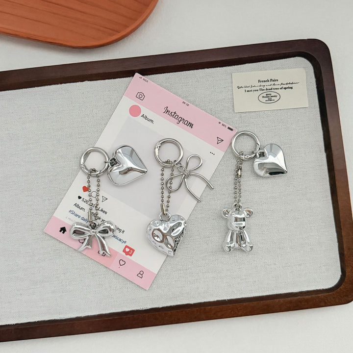 Heart-Shaped Charm Keychain with Bow Bowlift