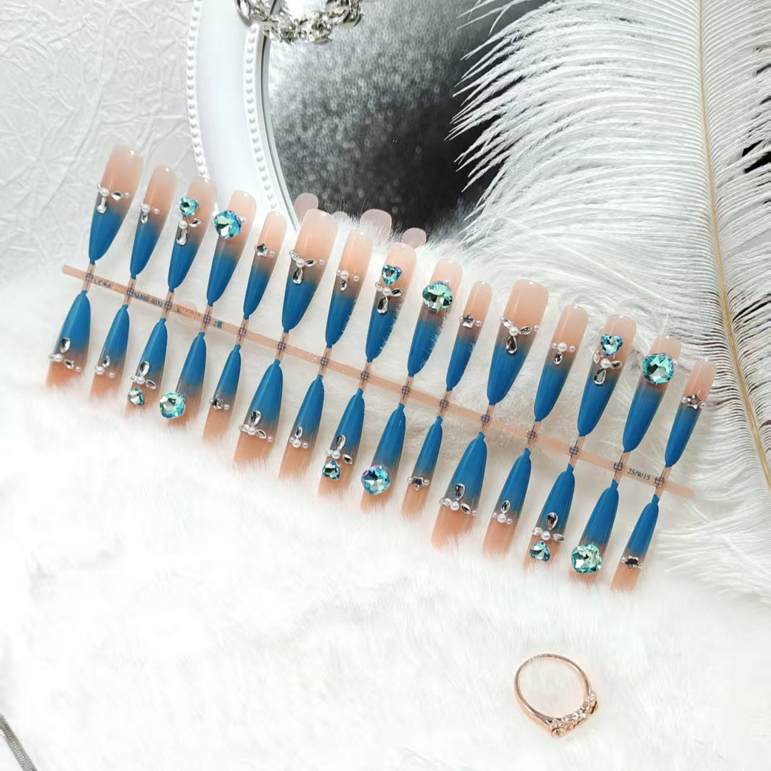 Artificial nails with elegant glitter and stone details Bowlift