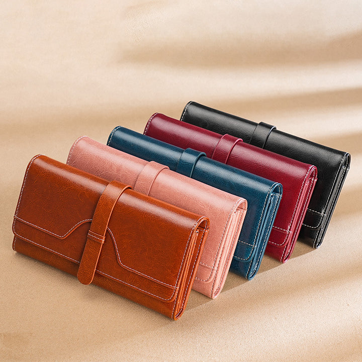 Premium leather long wallet clutch with strap closure and multiple card slots Bowlift