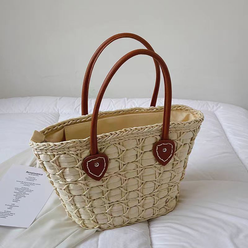 Handcrafted basket bag with elegant leather accents Bowlift