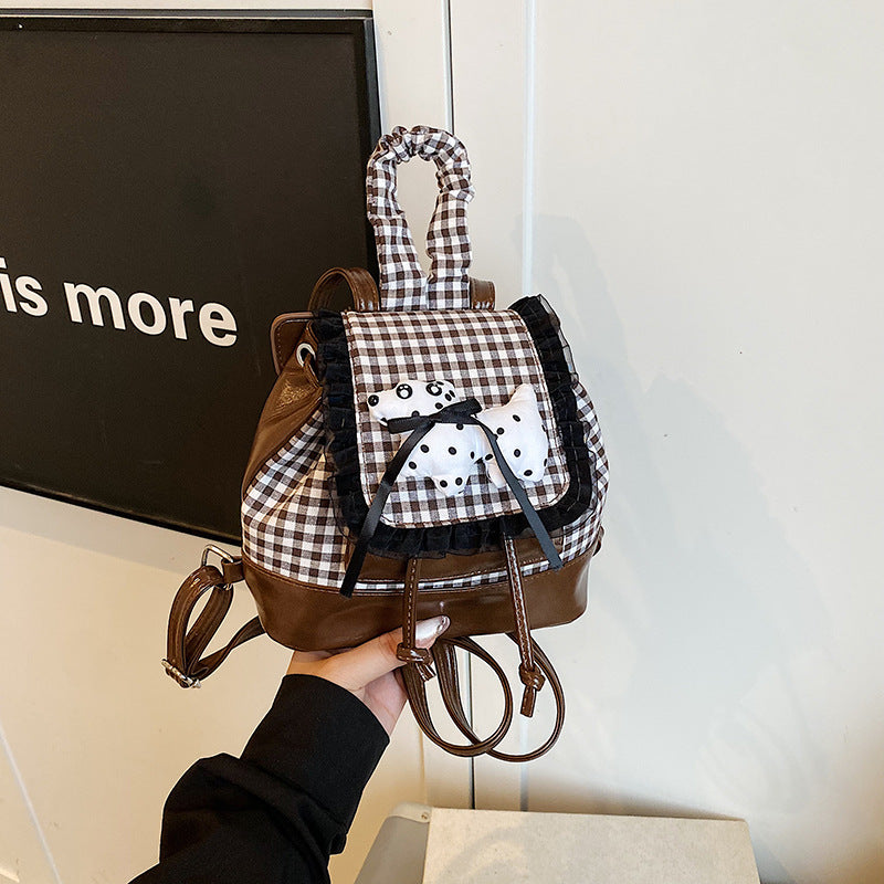 Playful backpack with checkered pattern and animal appliqué Bowlift
