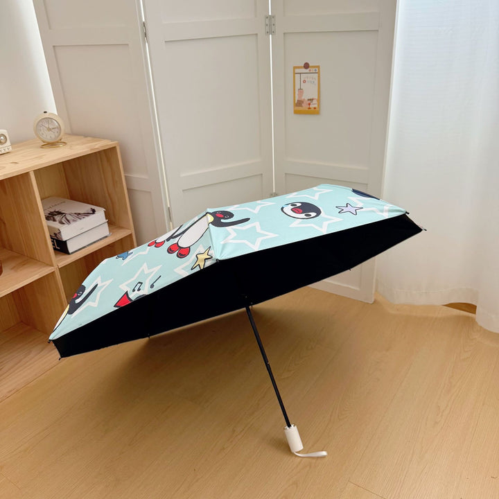 Ladies collapsible umbrella with playful penguin design Bowlift