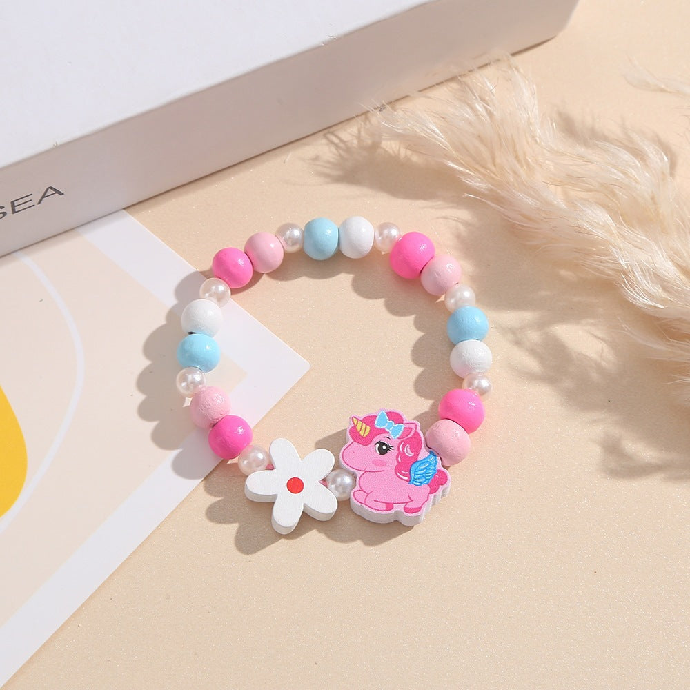 Playful children's bracelet with unicorn and flower motif Bowlift