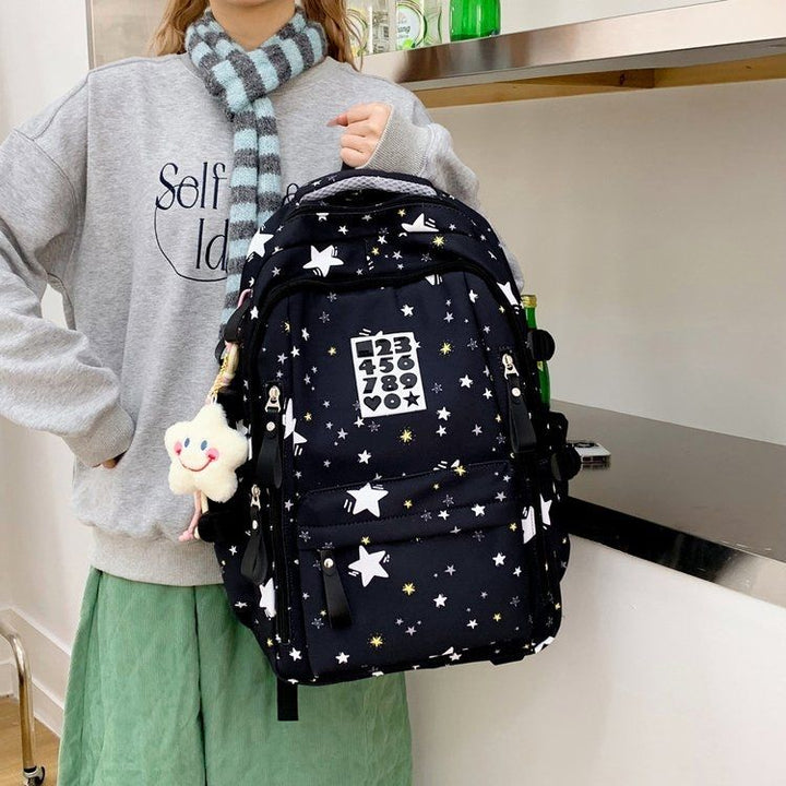 Playful backpack with star motifs and practical functions Bowlift