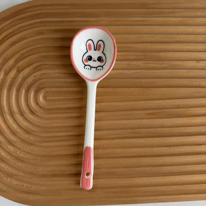 Ceramic soup spoon with lucky cat illustration and ergonomic long-handle Bowlift