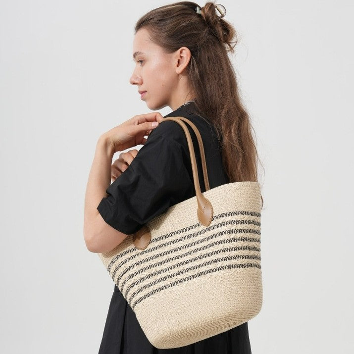 Beach bag made of natural woven material with elegant accents Bowlift