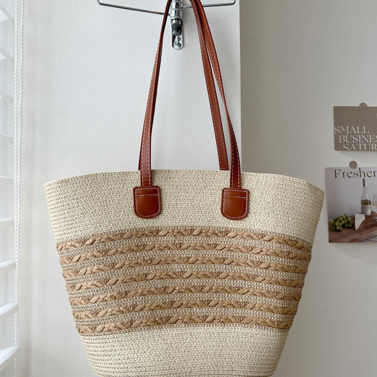 Handcrafted wicker bag with elegant leather accents Bowlift