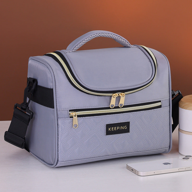 Cosmetic transport bag with insulated interior and practical compartments Bowlift