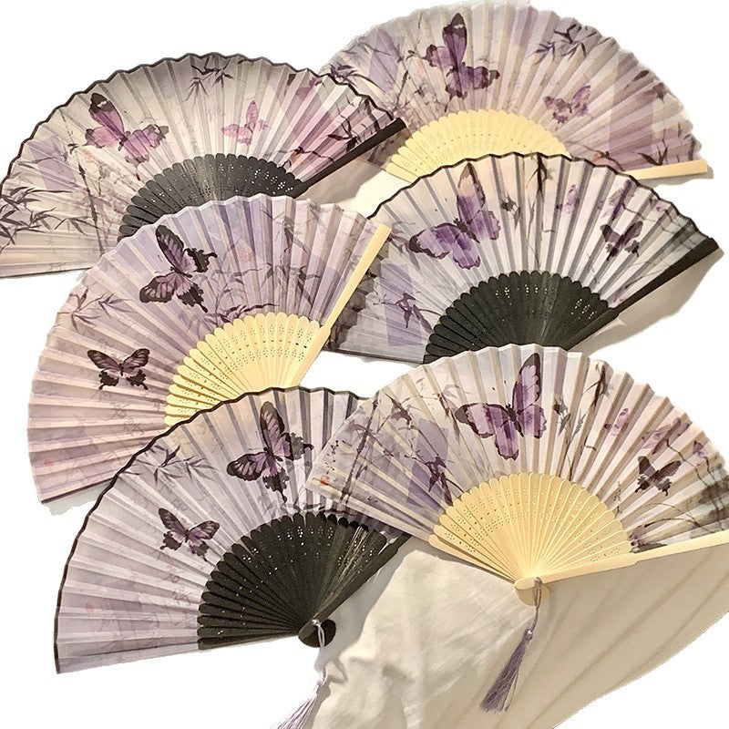 Elegant fan with elaborate butterfly motif Bowlift