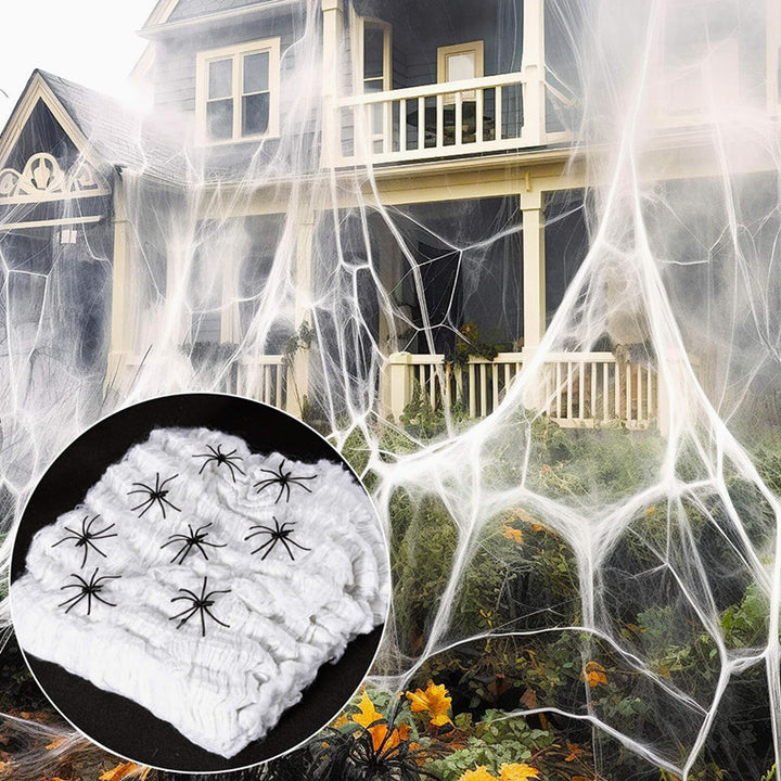 Decorative Halloween spider web with artificial spiders