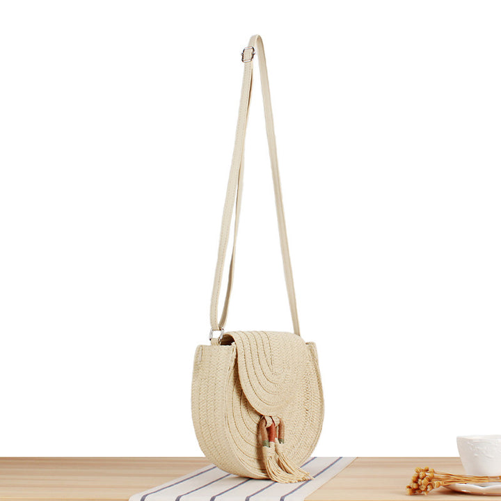 Round Bast Crossbody Bag with Tassels by Bowlift