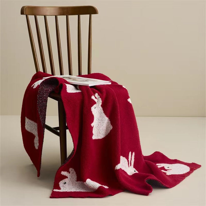 Jacquard knit cuddle blanket with rabbit motifs Bowlift