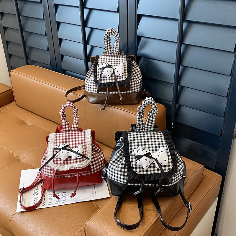Playful backpack with checkered pattern and animal appliqué Bowlift