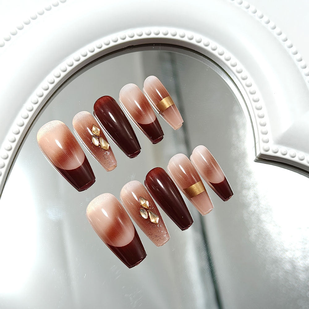 Luxurious artificial nails with glamorous decorations Bowlift