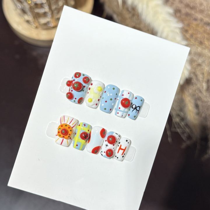 Artistic Press-On Nail Set with Playful Floral and Polka Dot Designs Bowlift