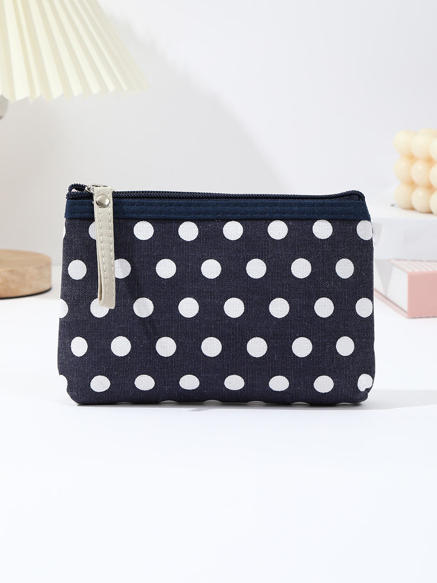 Canvas polka dot cosmetic pouch with zippered faux leather pull Bowlift