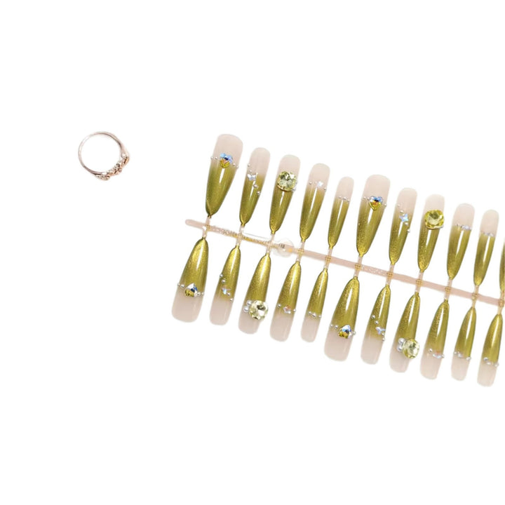 Artificial nail set with glamorous jewelry embellishments Bowlift
