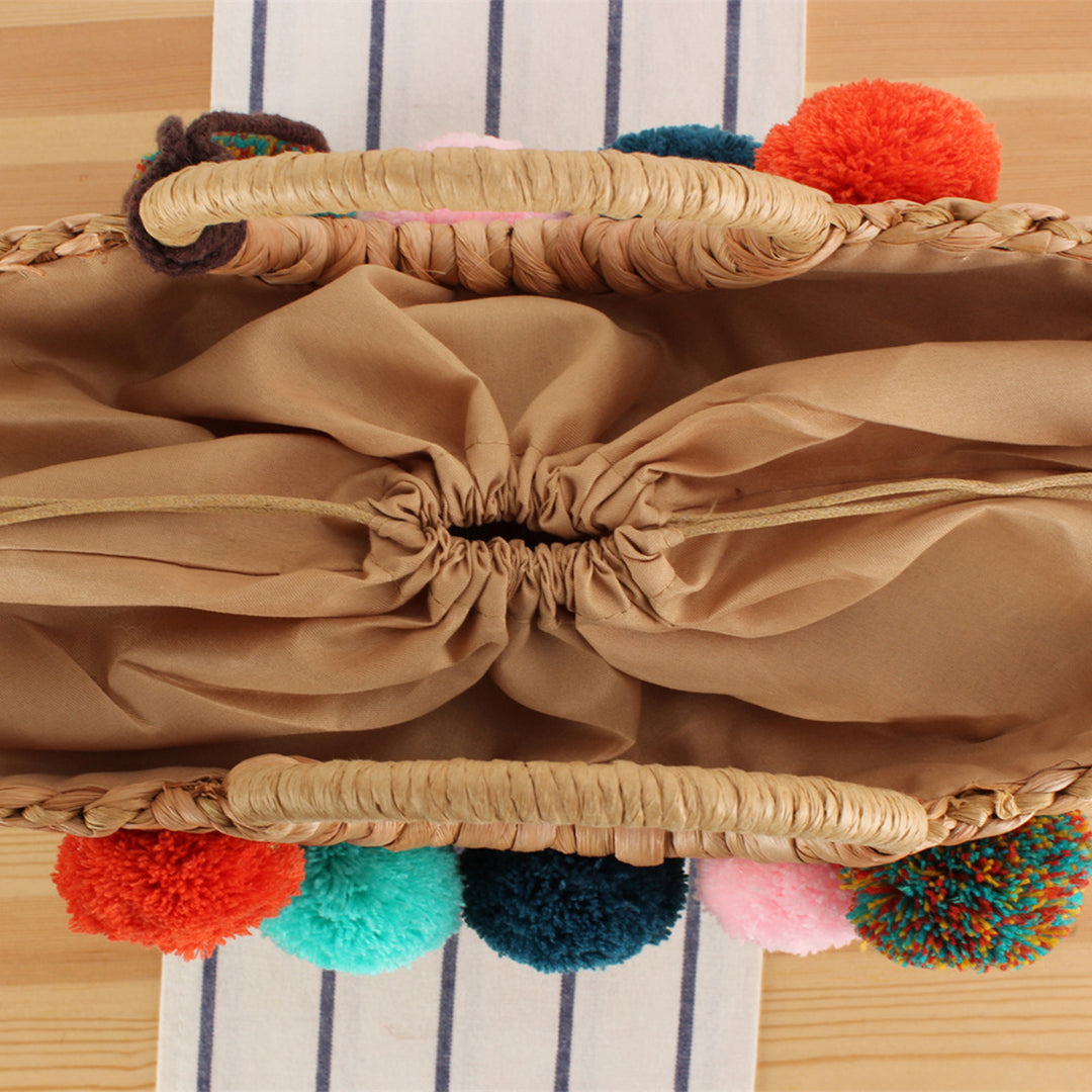 Basket bag with colorful pompons and carrying straps Bowlift