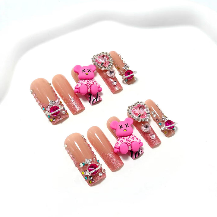 Artificial nail set with playful character motifs and glitter details Bowlift