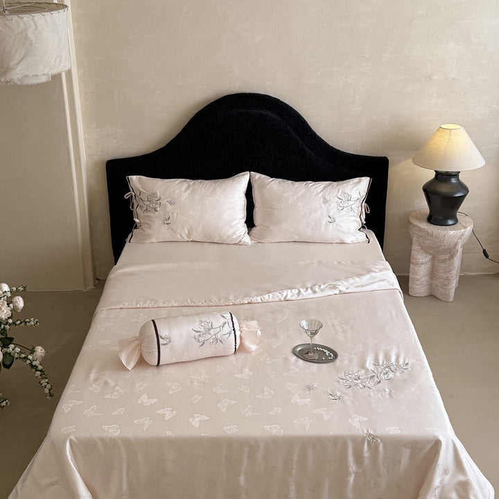 Light jacquard satin bed linen set with embroidered butterfly motif and decorative roll Bowlift
