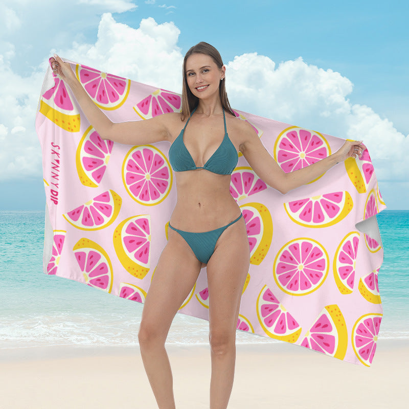 Beach towel with vibrant tropical plant motif Bowlift