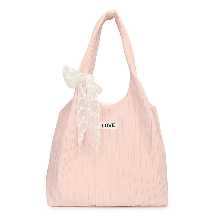 Leisure bag with structured design and playful scarf Bowlift