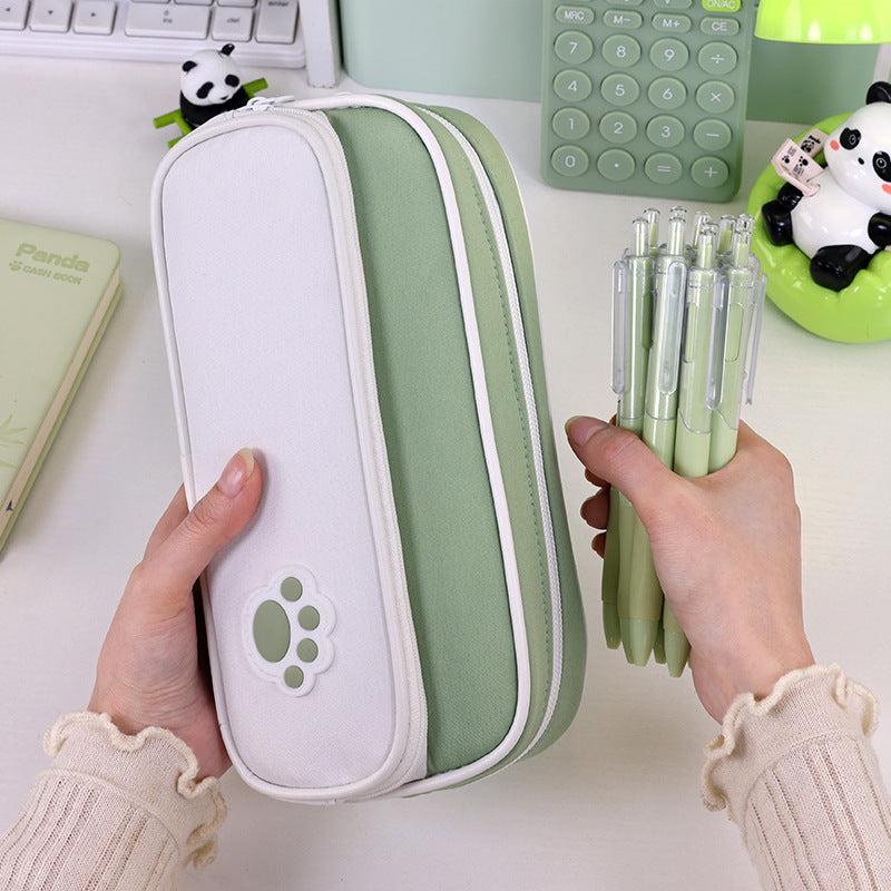 Pencil case with double compartment design and playful paw print motif Bowlift