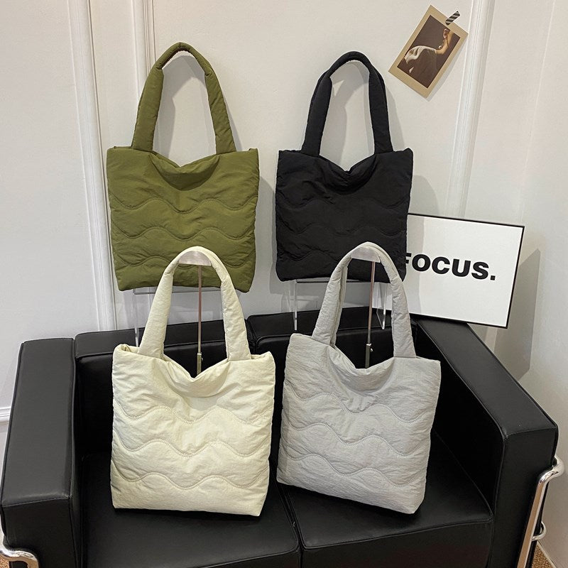 Padded shoulder bag with wave design Bowlift