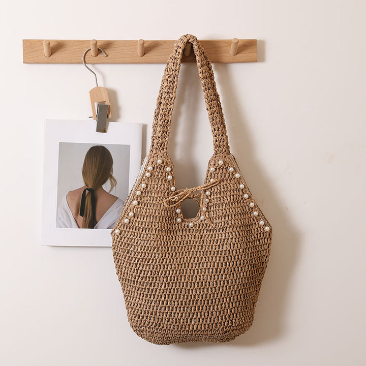Handbag with pearl decor and innovative closure Bowlift