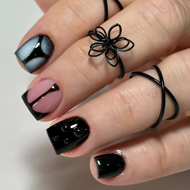 Artificial nails with elegant black and pastel accent design Bowlift