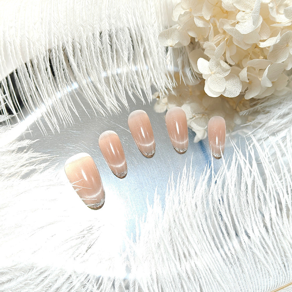 Artificial nails with elegant gloss and glitter accents Bowlift